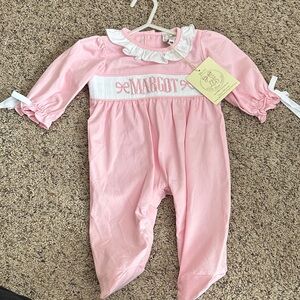 Pink “Margot” Smocked One-Piece Footie for Newborn Baby w/ Ruffle Collar + bows